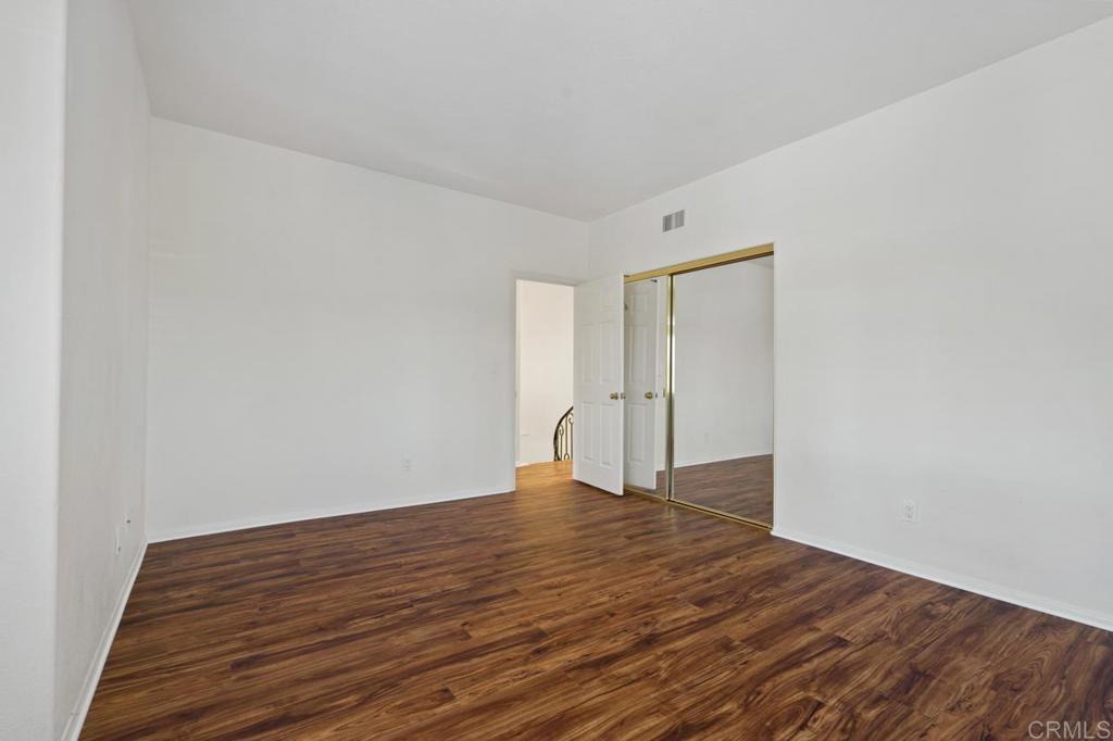 5402 Renaissance Avenue San Diego, CA 92122 - Photo 52 of 73 a view of empty room with wooden floor