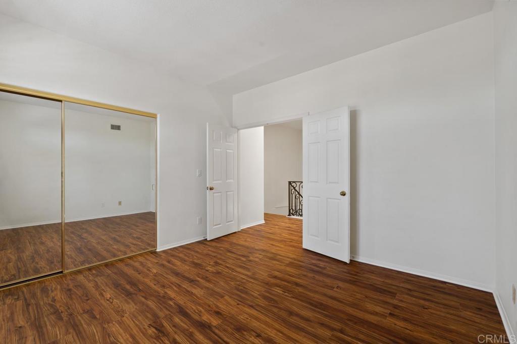 5402 Renaissance Avenue San Diego, CA 92122 - Photo 54 of 73 a view of empty room with wooden floor