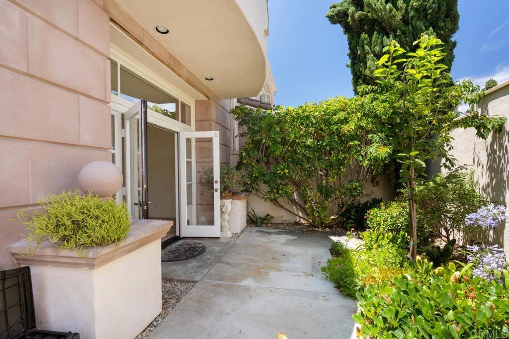 5402 Renaissance Avenue San Diego, CA 92122 - Photo 60 of 73 a front view of a house with a yard and plant