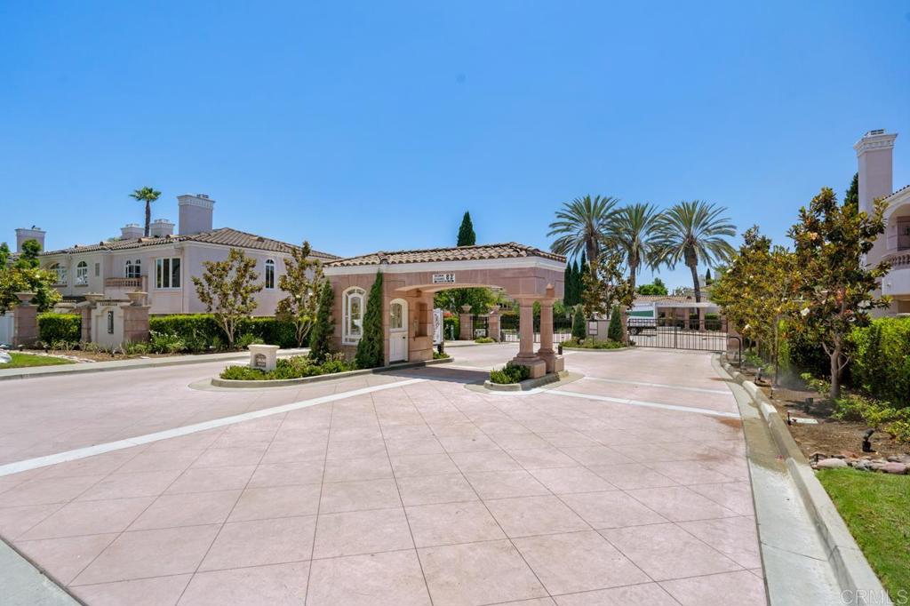 5402 Renaissance Avenue San Diego, CA 92122 - Photo 61 of 73 a front view of a house with a yard and outdoor seating
