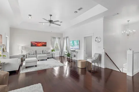 a living room with fireplace furniture and a wooden floor