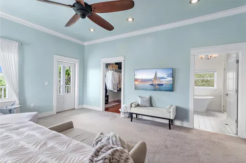 a bedroom with furniture and a window