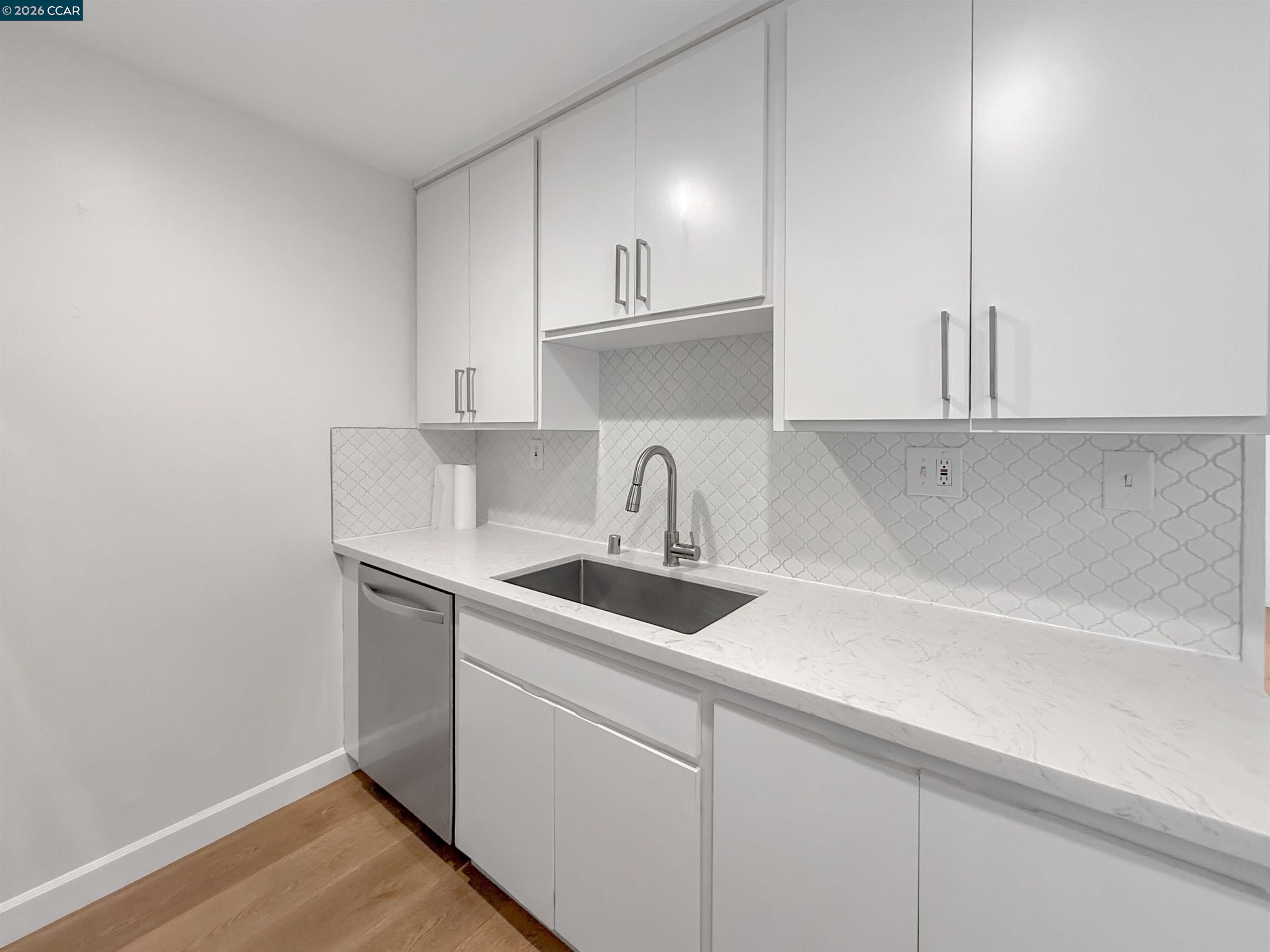 1919 Ygnacio Valley Road, Unit 55 Walnut Creek, CA 94598 - Photo 11 of 33 a kitchen with sink and cabinets