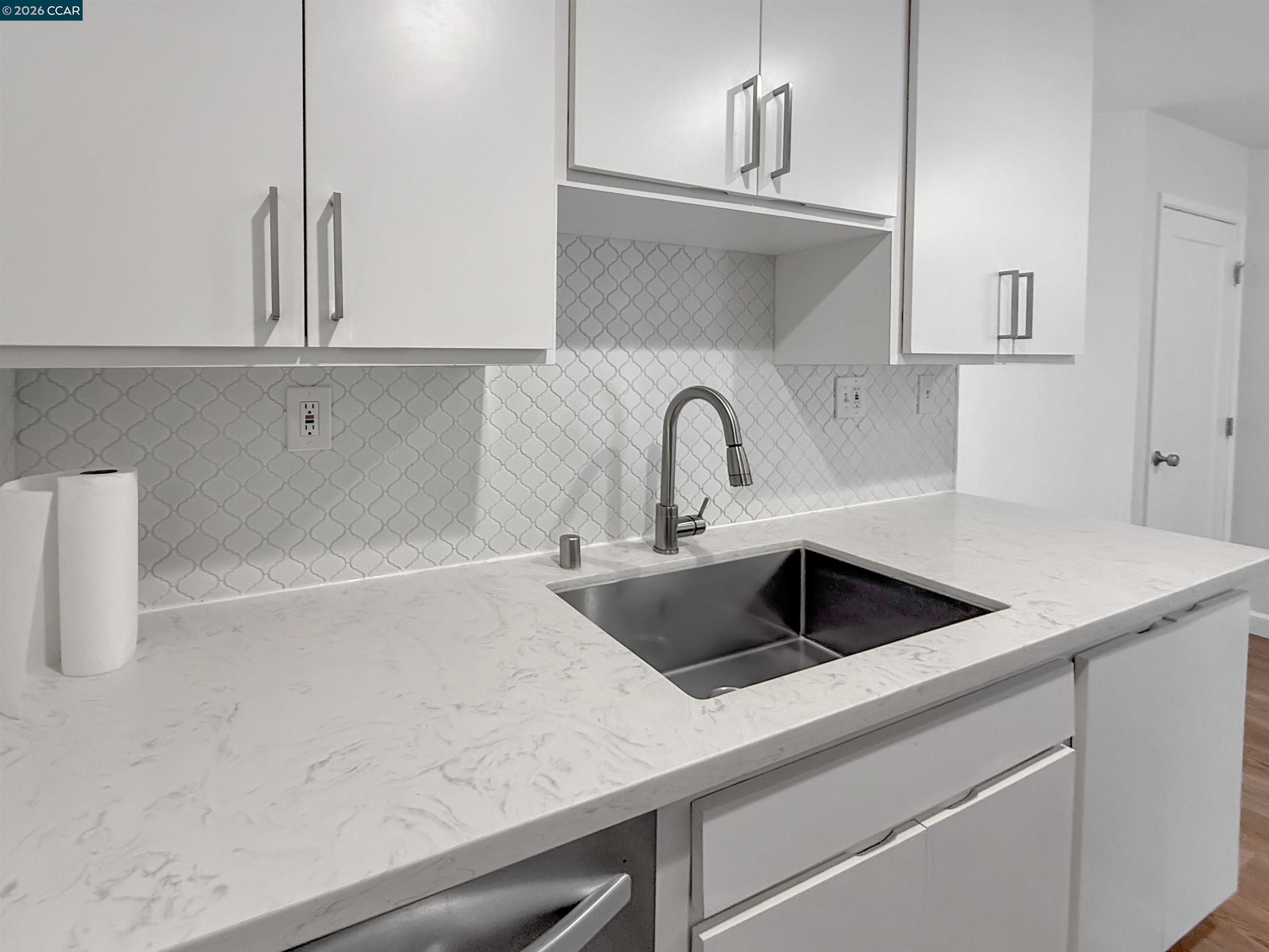 1919 Ygnacio Valley Road, Unit 55 Walnut Creek, CA 94598 - Photo 12 of 33 a kitchen with sink a refrigerator and cabinets