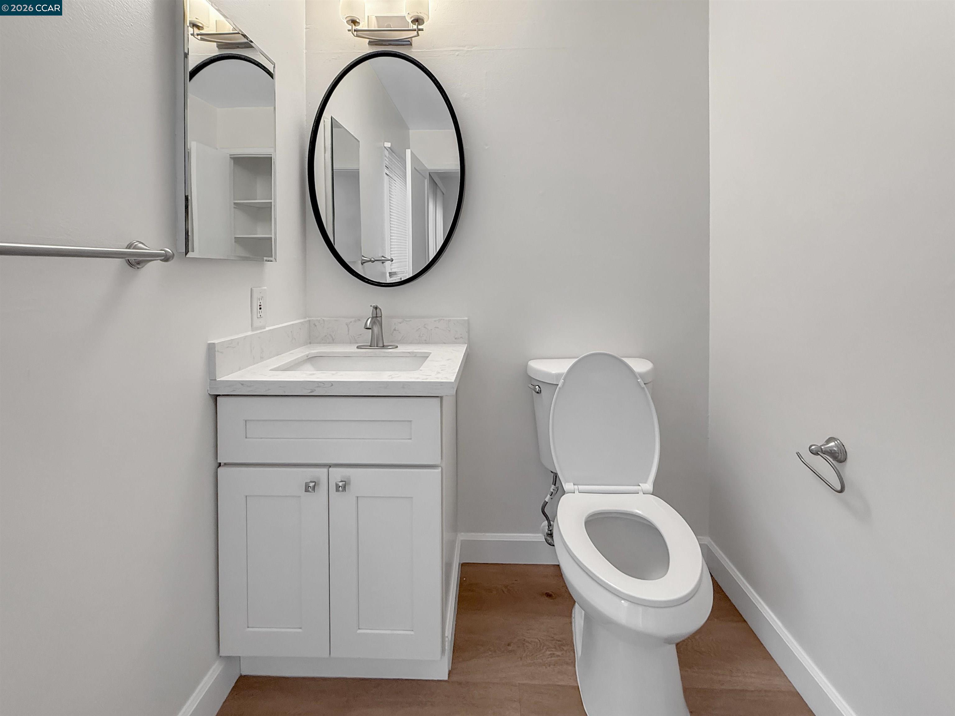 1919 Ygnacio Valley Road, Unit 55 Walnut Creek, CA 94598 - Photo 13 of 33 a bathroom with a toilet a sink and a mirror