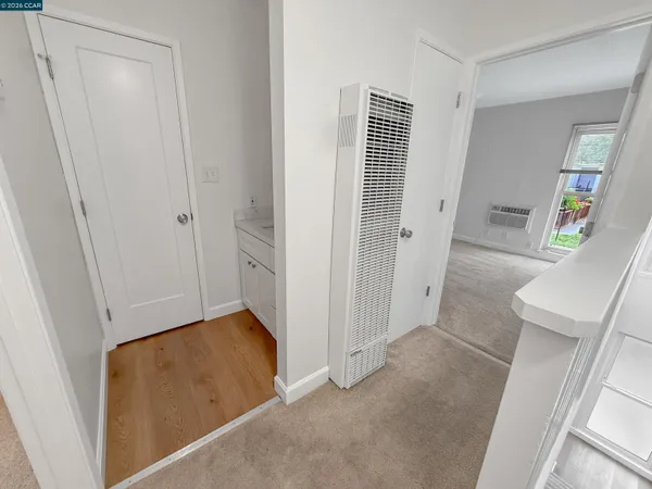 a view of room with window and hardwood floor