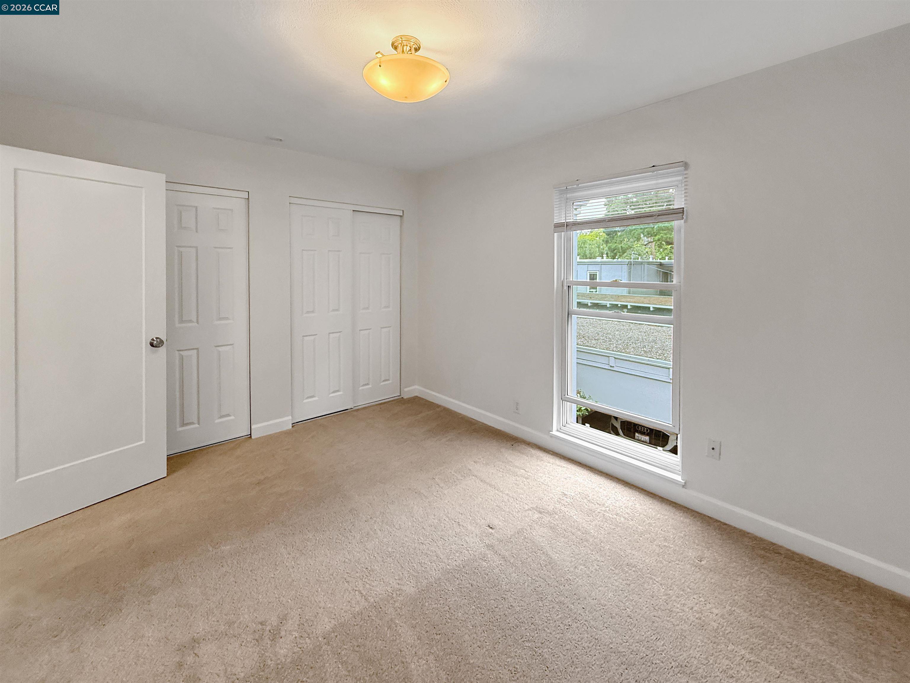 1919 Ygnacio Valley Road, Unit 55 Walnut Creek, CA 94598 - Photo 23 of 33 an empty room with windows