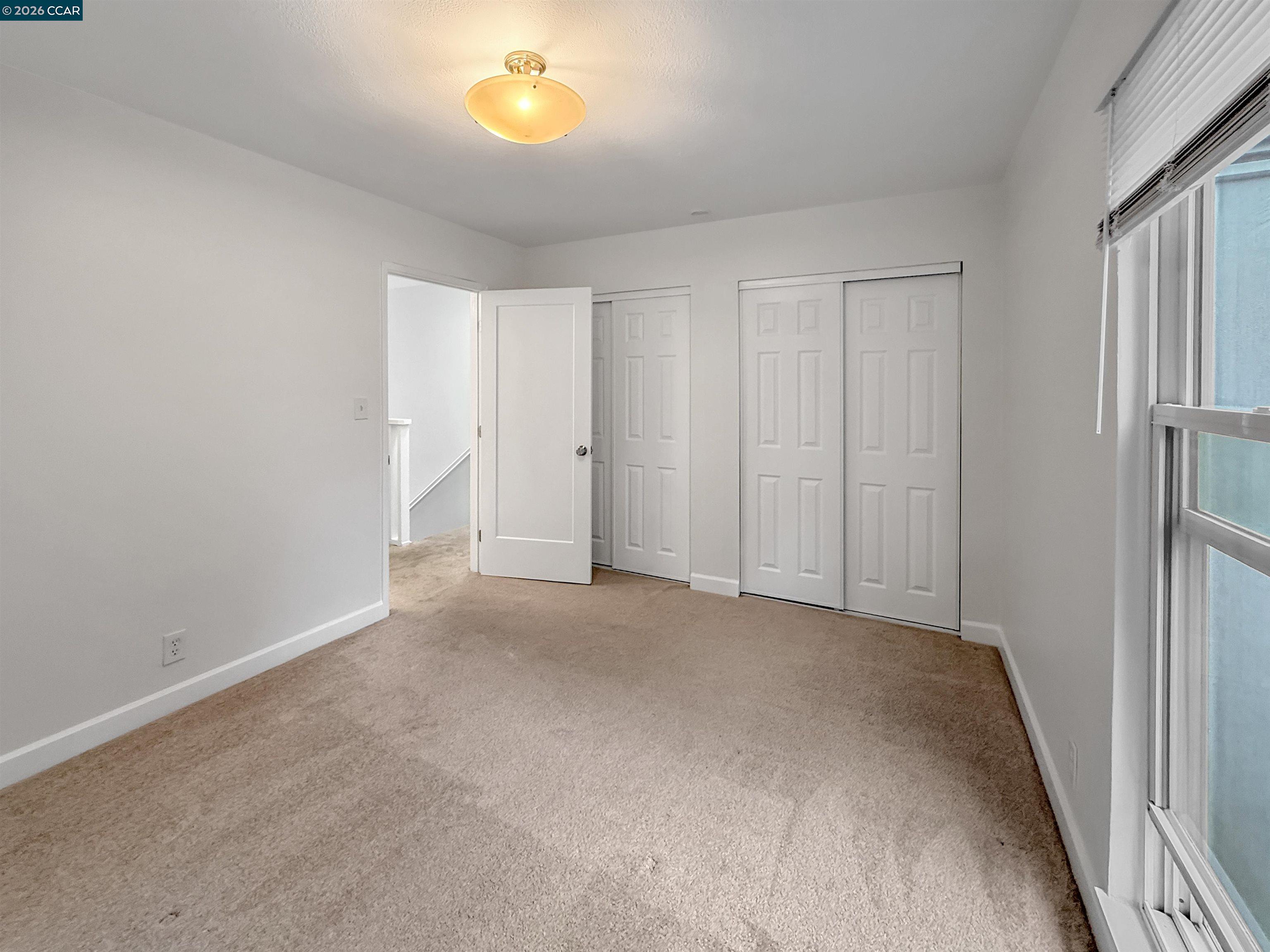 1919 Ygnacio Valley Road, Unit 55 Walnut Creek, CA 94598 - Photo 24 of 33 a view of an empty room and a window