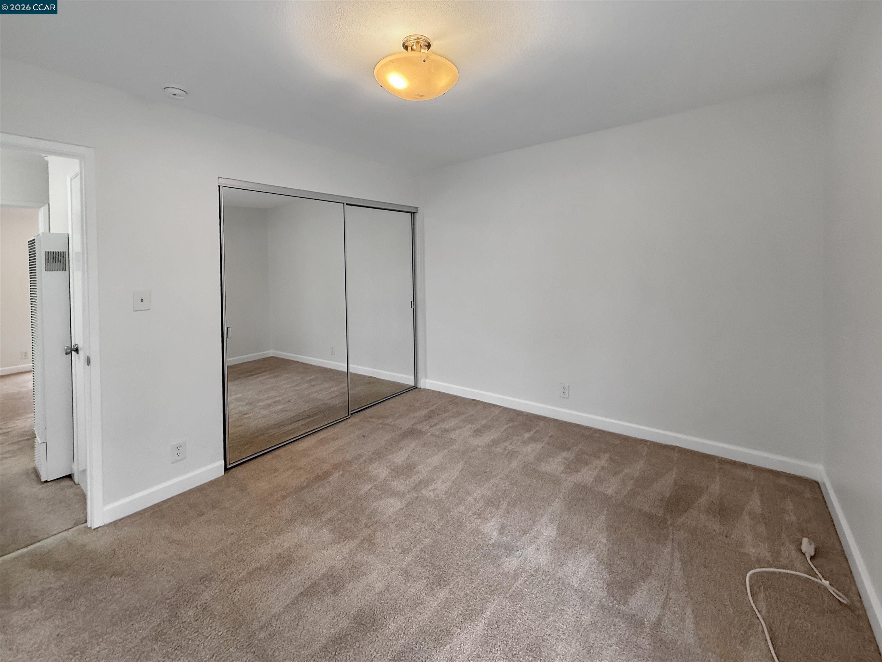1919 Ygnacio Valley Road, Unit 55 Walnut Creek, CA 94598 - Photo 26 of 33 an empty room with windows and closet