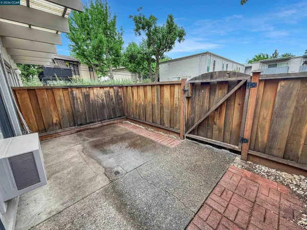 a view of backyard with seating space