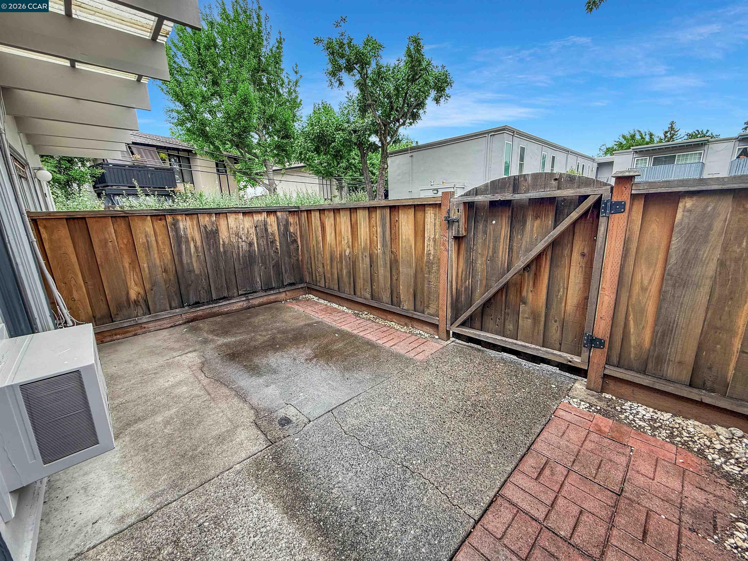 1919 Ygnacio Valley Road, Unit 55 Walnut Creek, CA 94598 - Photo 29 of 33 a view of a backyard with a wooden fence
