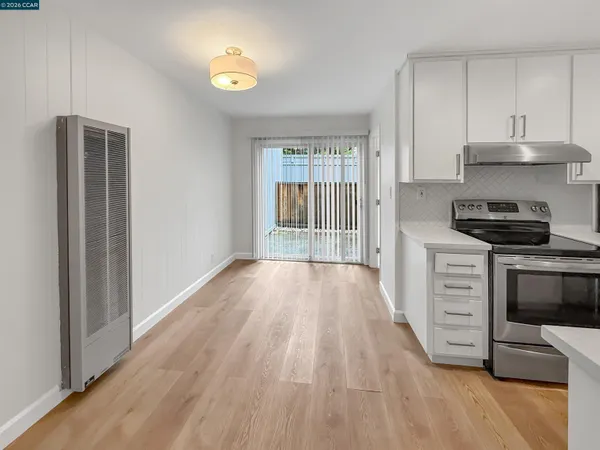 a kitchen with stainless steel appliances a stove a sink and a refrigerator