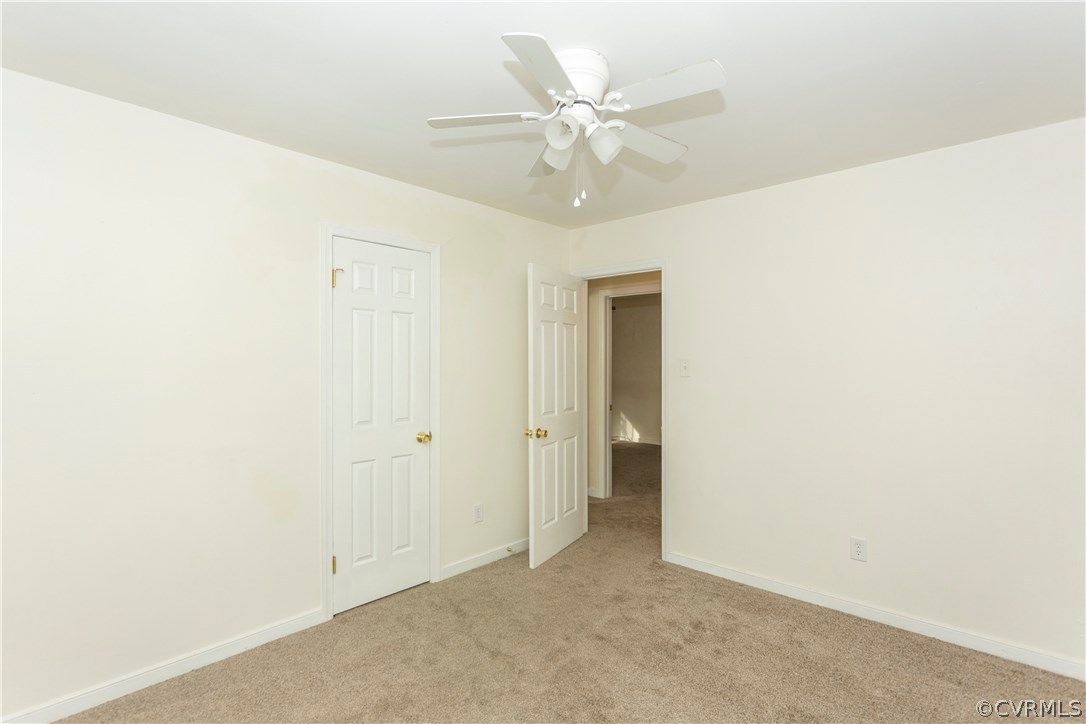 5809 Mill Spring Lane Midlothian, VA 23112 - Photo 15 of 35 an empty room with a ceiling fan and a window