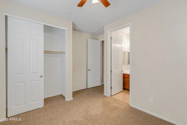 a bathroom with a sink a toilet and shower curtain