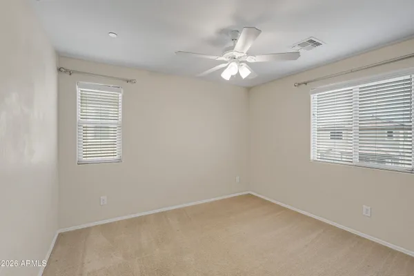 a large bathroom with a double vanity sink and a mirror