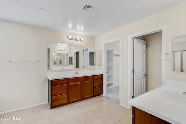 a view of an empty room with a cabinet