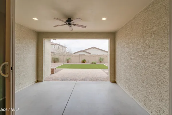 a view of a livingroom with a furniture and a ceiling fan
