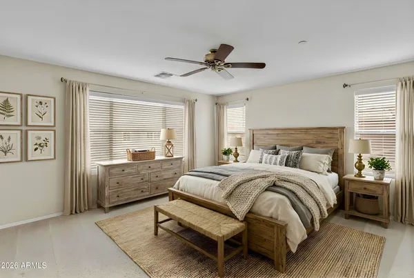 a living room with furniture kitchen view and a large window