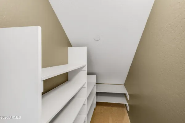 an empty room with windows and entrance