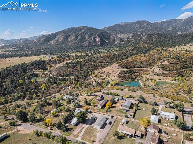 8440 Piute Road Colorado Springs, CO 80926 - Photo 30 of 34 Set against breathtaking Cheyenne Mountain views, the open front of the property captures the essence of country living.