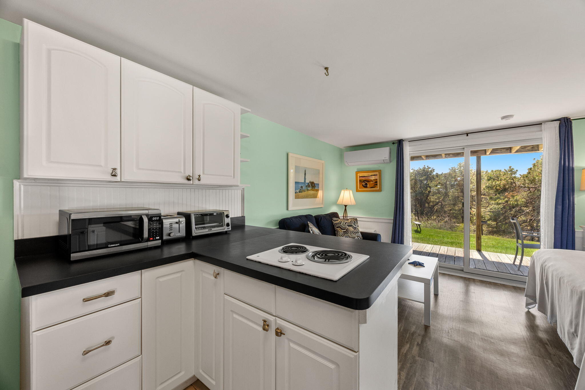 132 Shore Road, Unit 13 Truro, MA 02666 - Photo 4 of 21 a kitchen that has a sink and a stove