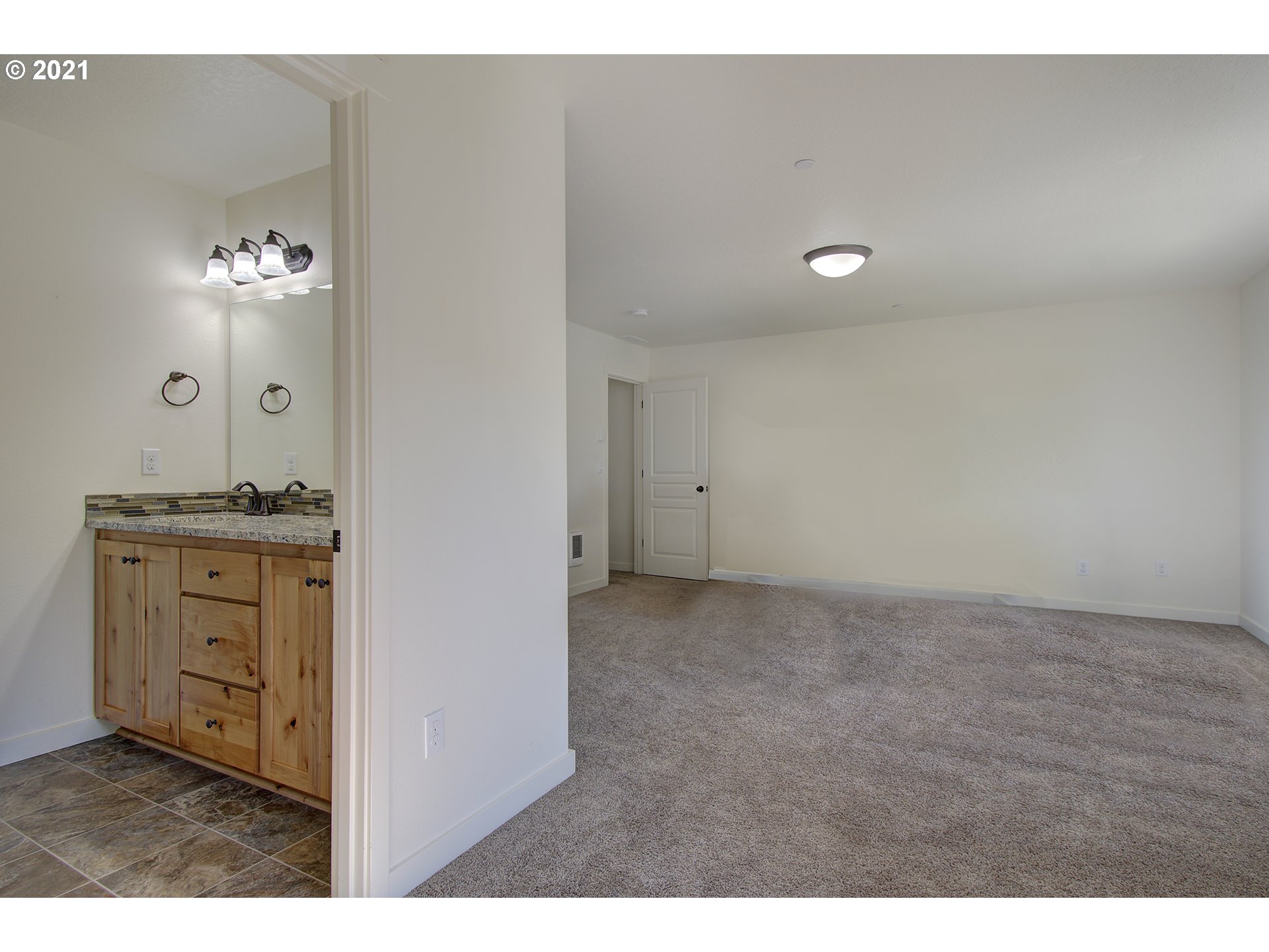 162 North 41st Place Ridgefield, WA 98642 - Photo 19 of 29 a view of cabinet with mirror
