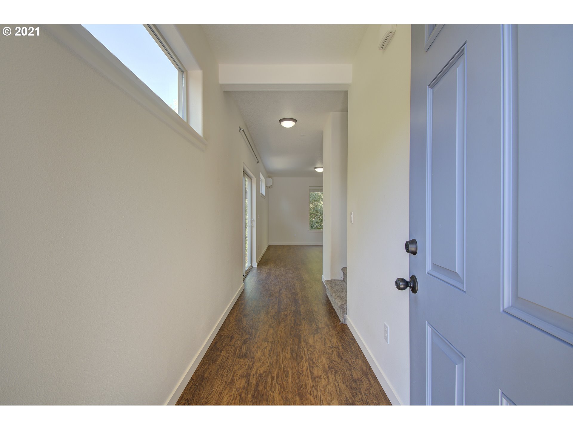 162 North 41st Place Ridgefield, WA 98642 - Photo 3 of 29 a view of a hallway with wooden floor