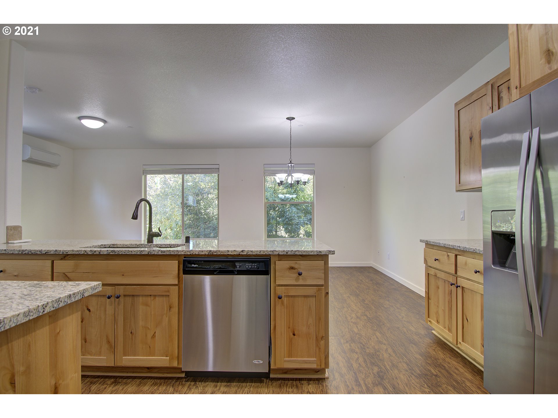 162 North 41st Place Ridgefield, WA 98642 - Photo 6 of 29 a kitchen with stainless steel appliances granite countertop a sink a stove and a refrigerator
