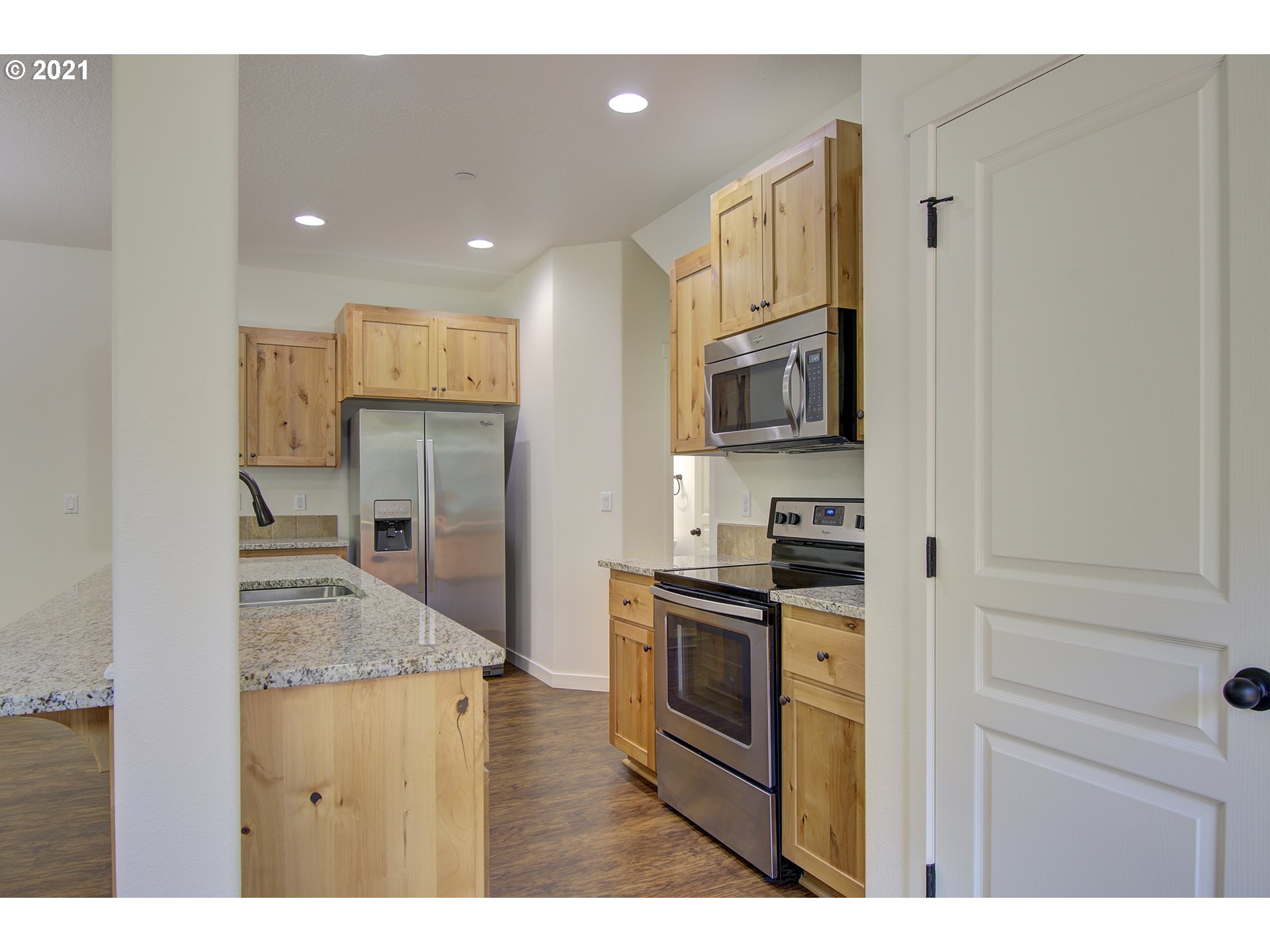 162 North 41st Place Ridgefield, WA 98642 - Photo 7 of 29 a kitchen with stainless steel appliances granite countertop a stove refrigerator and a sink