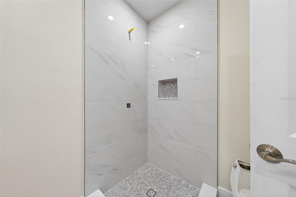 7108 Midnight Pass Road Sarasota, FL 34242 - Photo 32 of 83 a bathroom with a shower