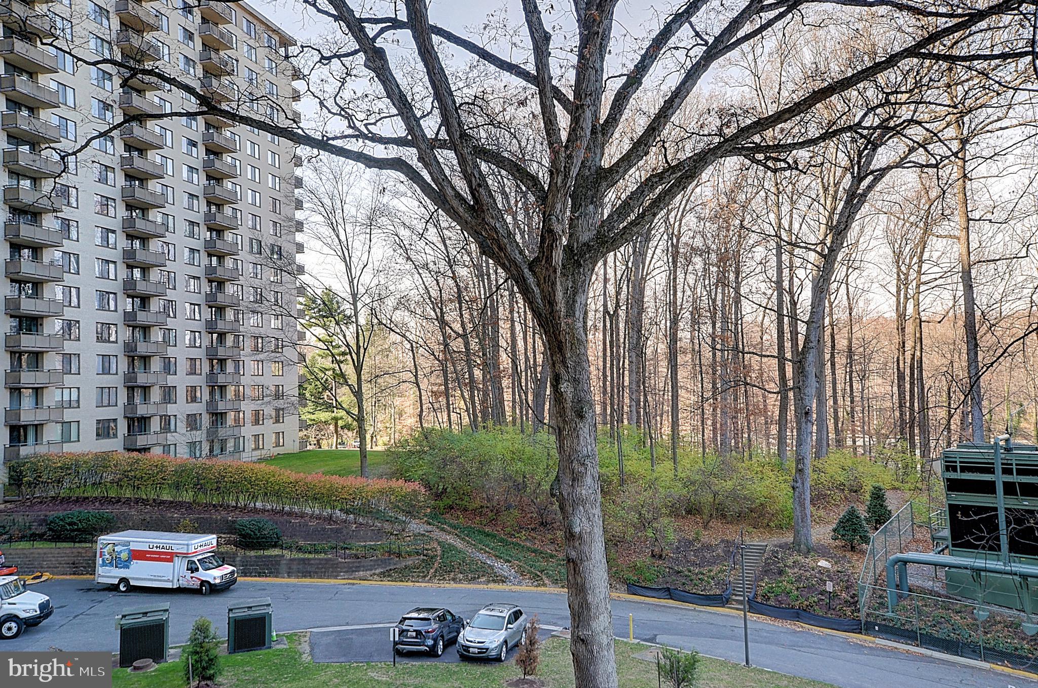 5225 Pooks Hill Road, Unit 324N Bethesda, MD 20814 - Photo 12 of 34 a view of a couches and dinning table and chair in the patio