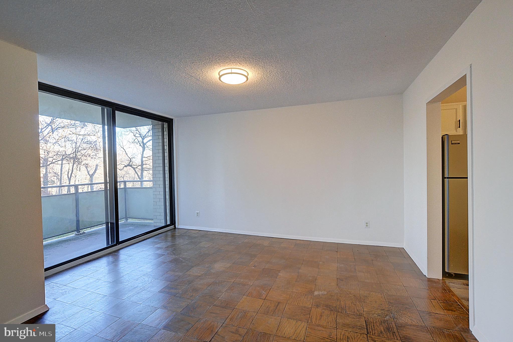 5225 Pooks Hill Road, Unit 324N Bethesda, MD 20814 - Photo 3 of 34 a view of an empty room with glass door