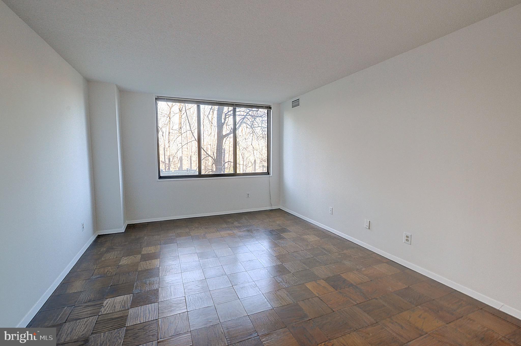 5225 Pooks Hill Road, Unit 324N Bethesda, MD 20814 - Photo 5 of 34 an empty room with windows