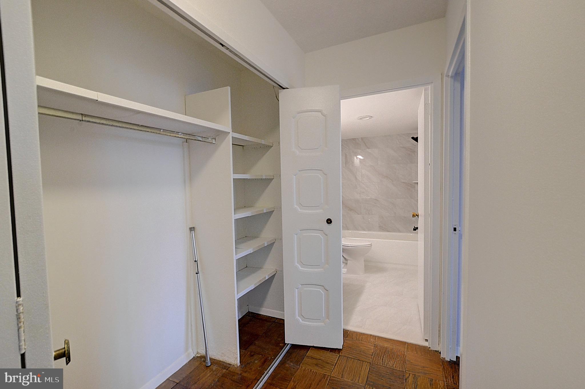 5225 Pooks Hill Road, Unit 324N Bethesda, MD 20814 - Photo 7 of 34 a view of walk in closet with empty racks