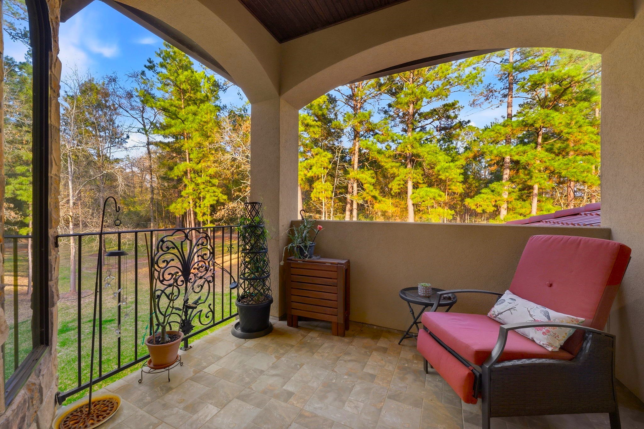 280 Sundog Road Huntsville, TX 77340 - Photo 38 of 50 Private upstairs balcony offering another peaceful outdoor space overlooking the expansive front of the property.