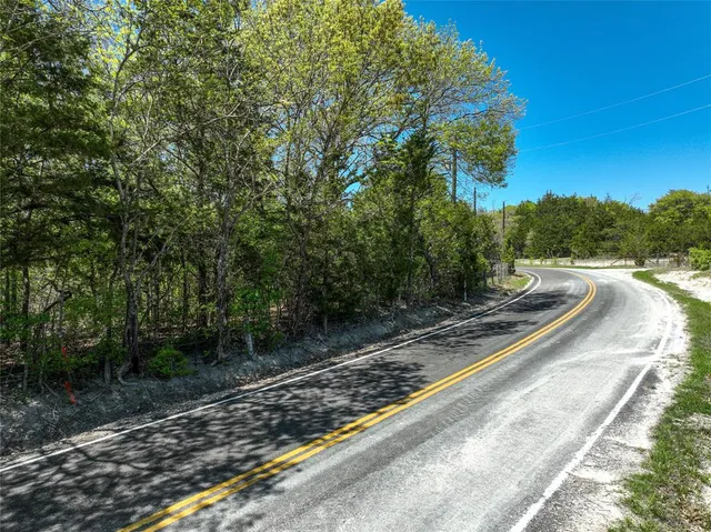a view of a road with a trees