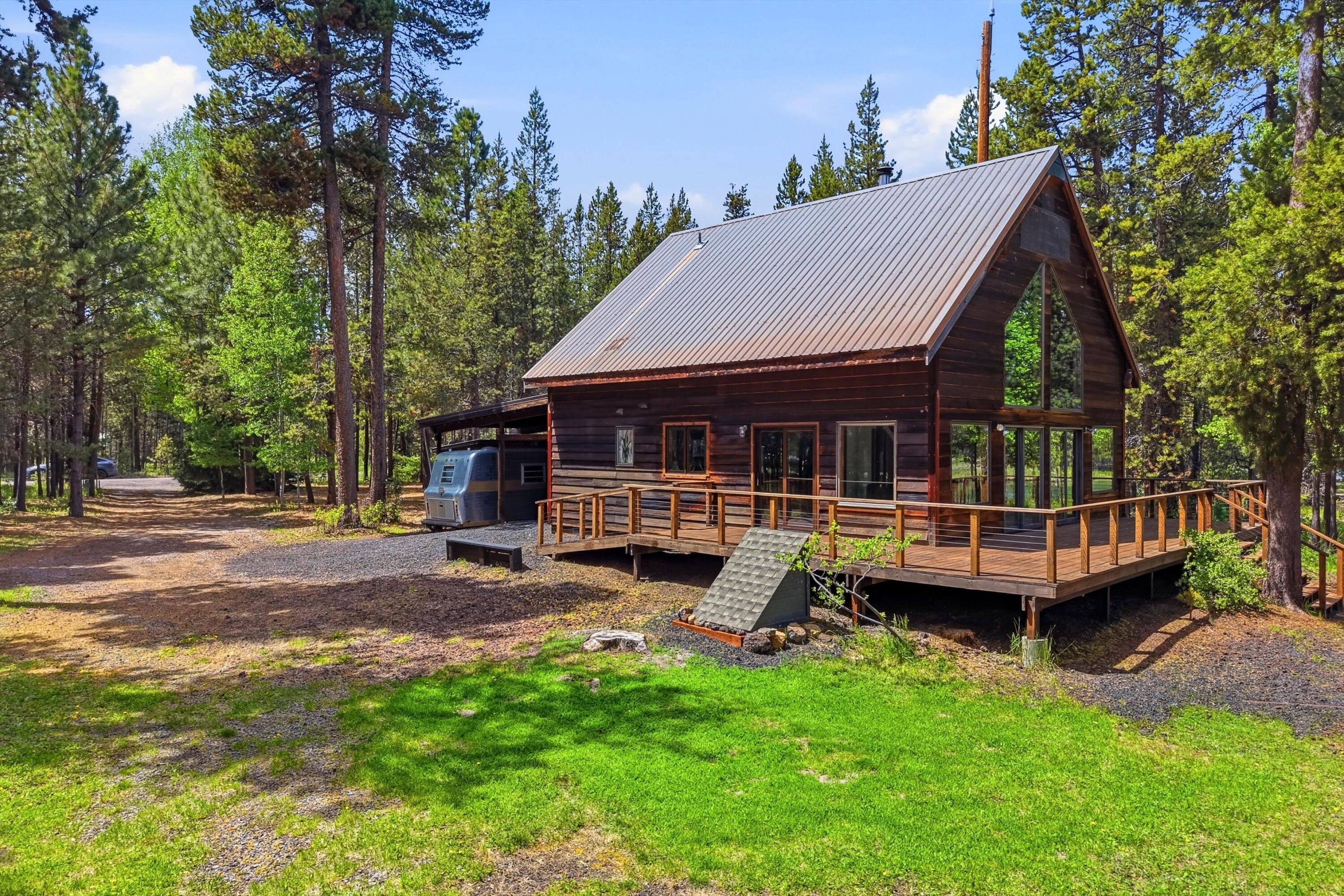 56446 Eclipse Drive Bend, OR 97707 - Photo 2 of 42 a view of a house with a yard and sitting area