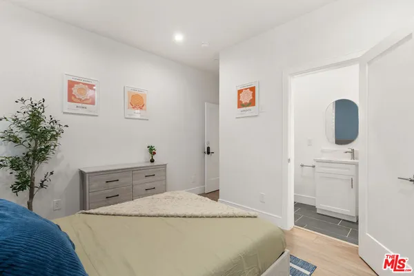 a bedroom with a bed and a table