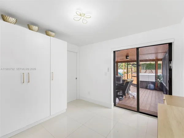 a view of a room with a bed and a balcony