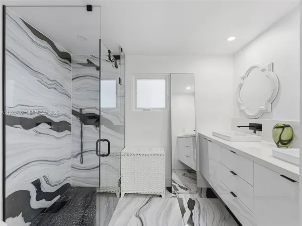 a bathroom with a sink and a mirror