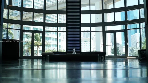 a view of a floor to ceiling window and an outdoor space