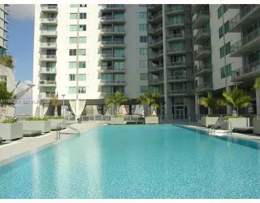 a front view of a building with a garden