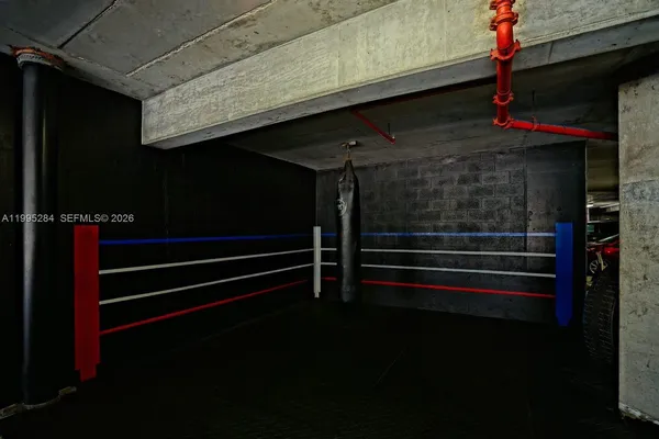 a backyard of a house with barbeque oven table and chairs