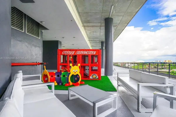 a view of a cafe with sitting area