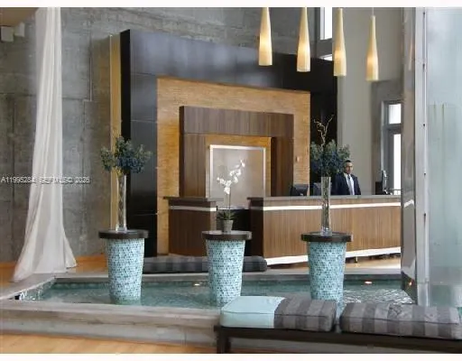 a swimming pool with a table and chairs