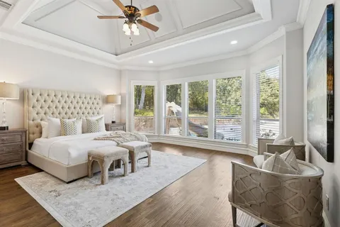 a bedroom with a large bed and a couch