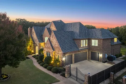 a aerial view of a house with a yard