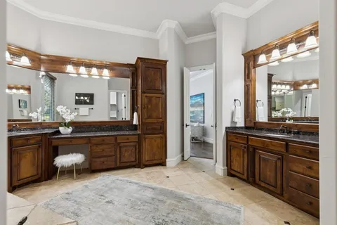 a large bathroom with a sink and a large mirror