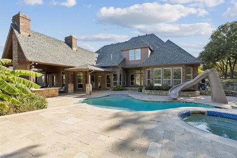 a view of a patio with a table and chairs