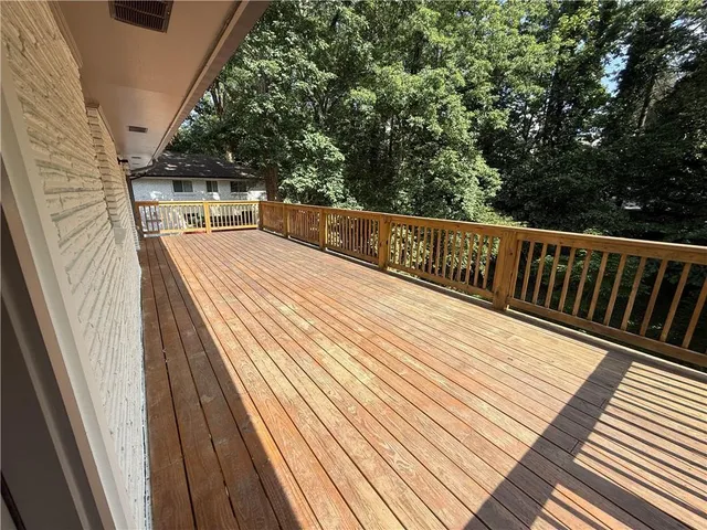 a balcony with trees